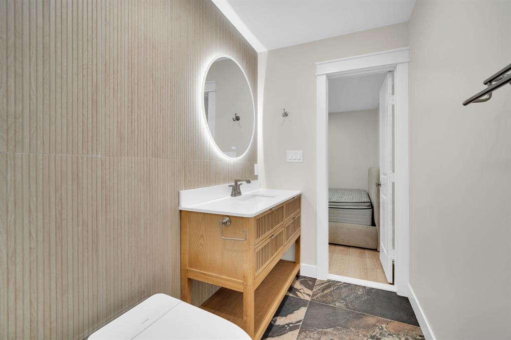 100 North Valley Street Red Oak, TX 75154 - Photo 10 of 31 a bathroom with a sink a toilet and a mirror