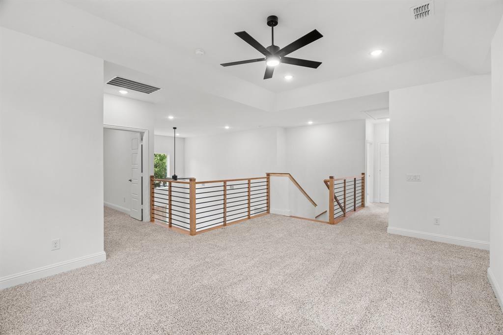 848 Northwood Road Fort Worth, TX 76107 - Photo 21 of 40 an empty room with a ceiling fan and a rug