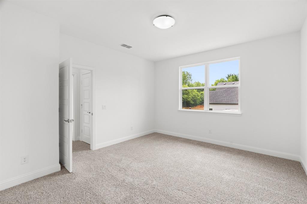 848 Northwood Road Fort Worth, TX 76107 - Photo 25 of 40 an empty room with windows and closet