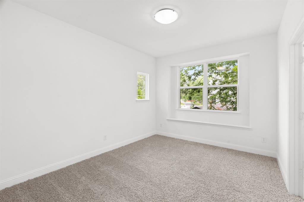 848 Northwood Road Fort Worth, TX 76107 - Photo 27 of 40 an empty room with windows