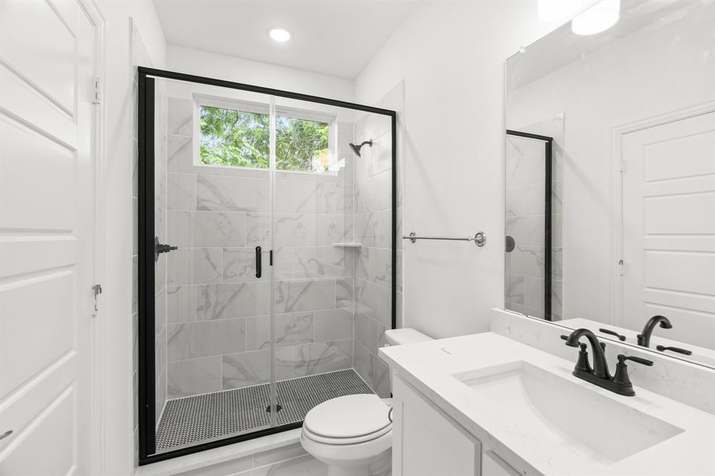 848 Northwood Road Fort Worth, TX 76107 - Photo 29 of 40 a bathroom with a sink toilet and shower