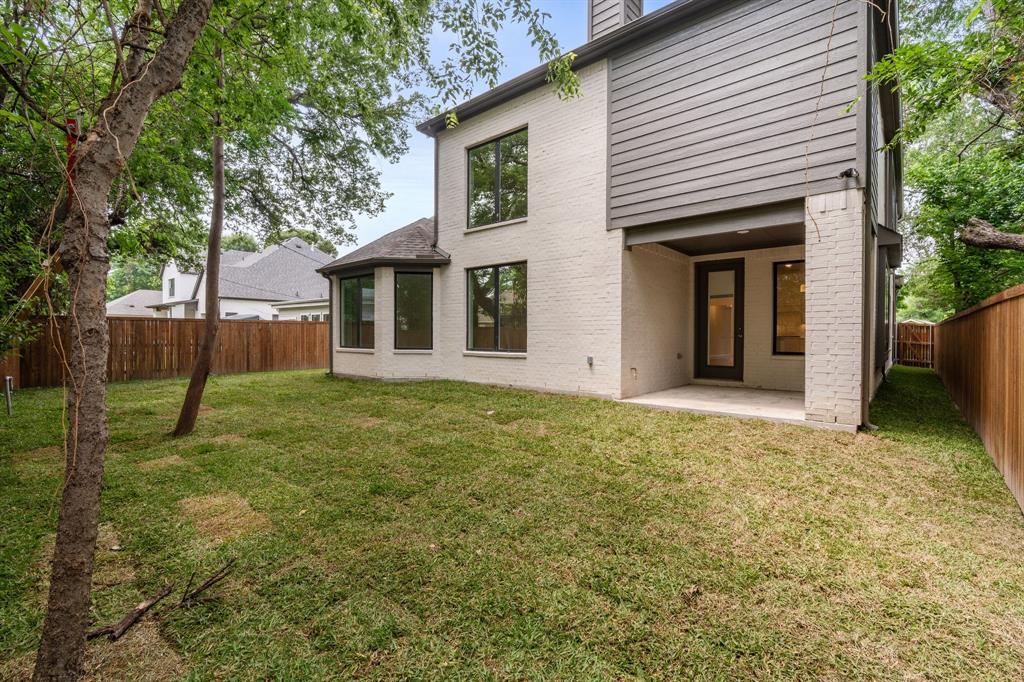 848 Northwood Road Fort Worth, TX 76107 - Photo 30 of 40 a view of an house with backyard and a tree