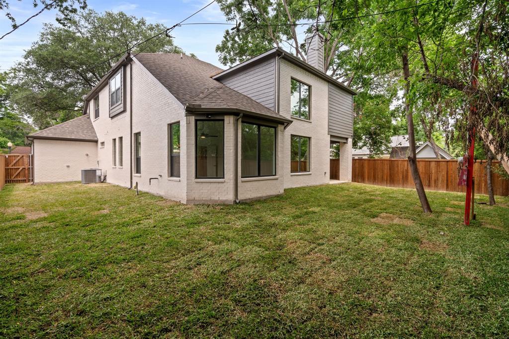 848 Northwood Road Fort Worth, TX 76107 - Photo 31 of 40 a view of a house with a yard