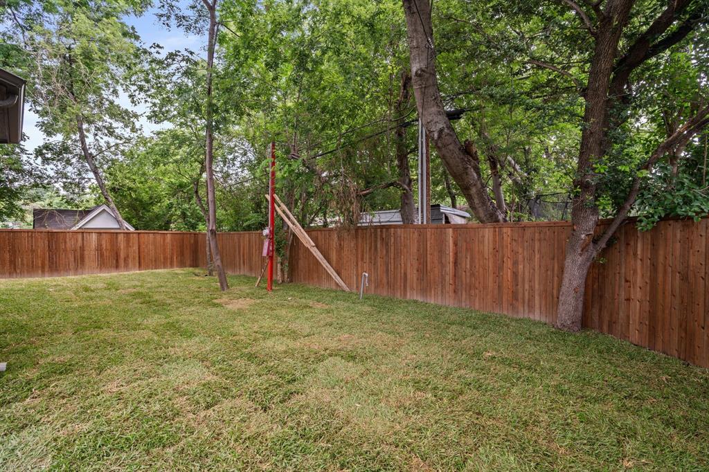 848 Northwood Road Fort Worth, TX 76107 - Photo 32 of 40 a view of backyard with wooden fences