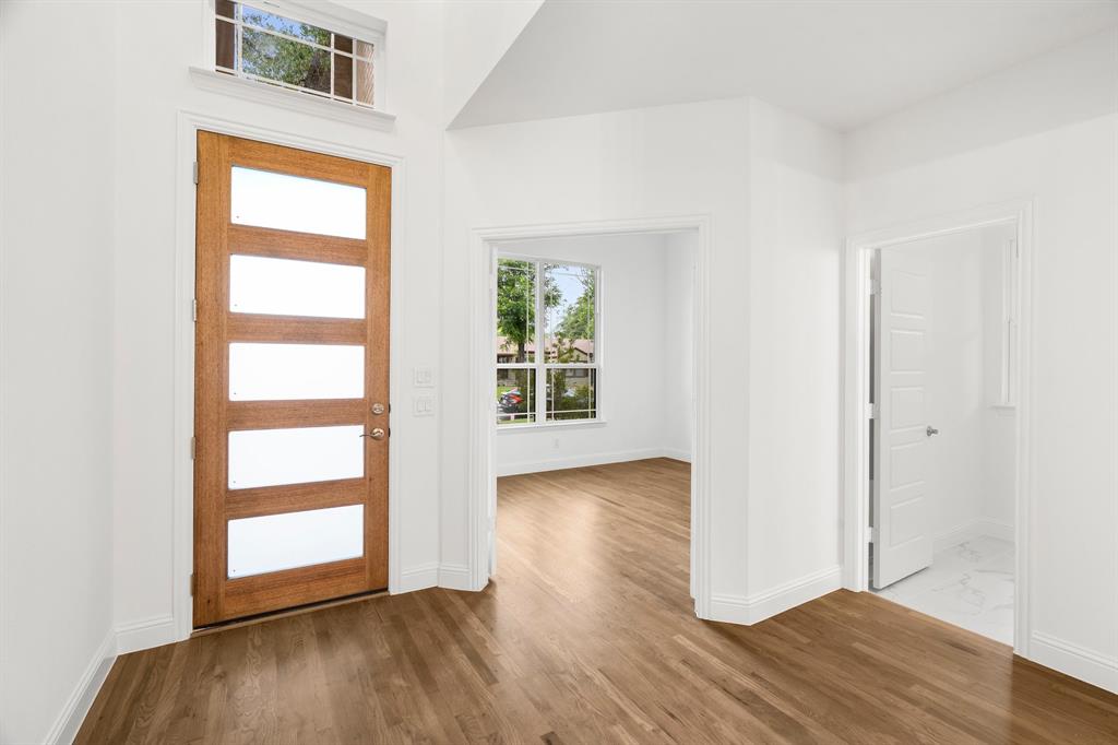 848 Northwood Road Fort Worth, TX 76107 - Photo 4 of 40 an empty room with wooden floor closet and windows