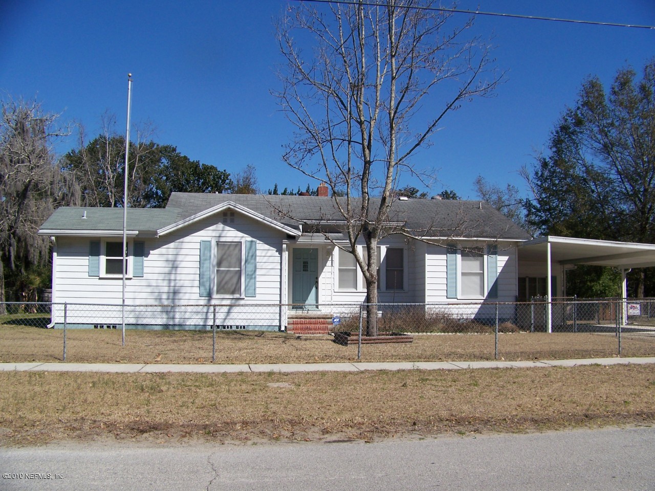 9761 Kline Road Jacksonville, FL 32246 - Photo 1 of 71 a front view of a house with a garden