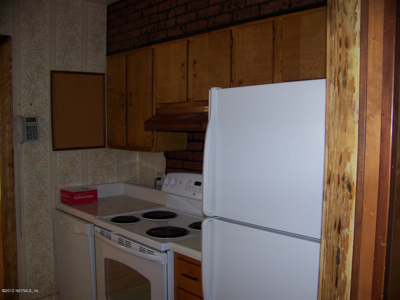 9761 Kline Road Jacksonville, FL 32246 - Photo 15 of 71 a kitchen with a refrigerator and a stove top oven