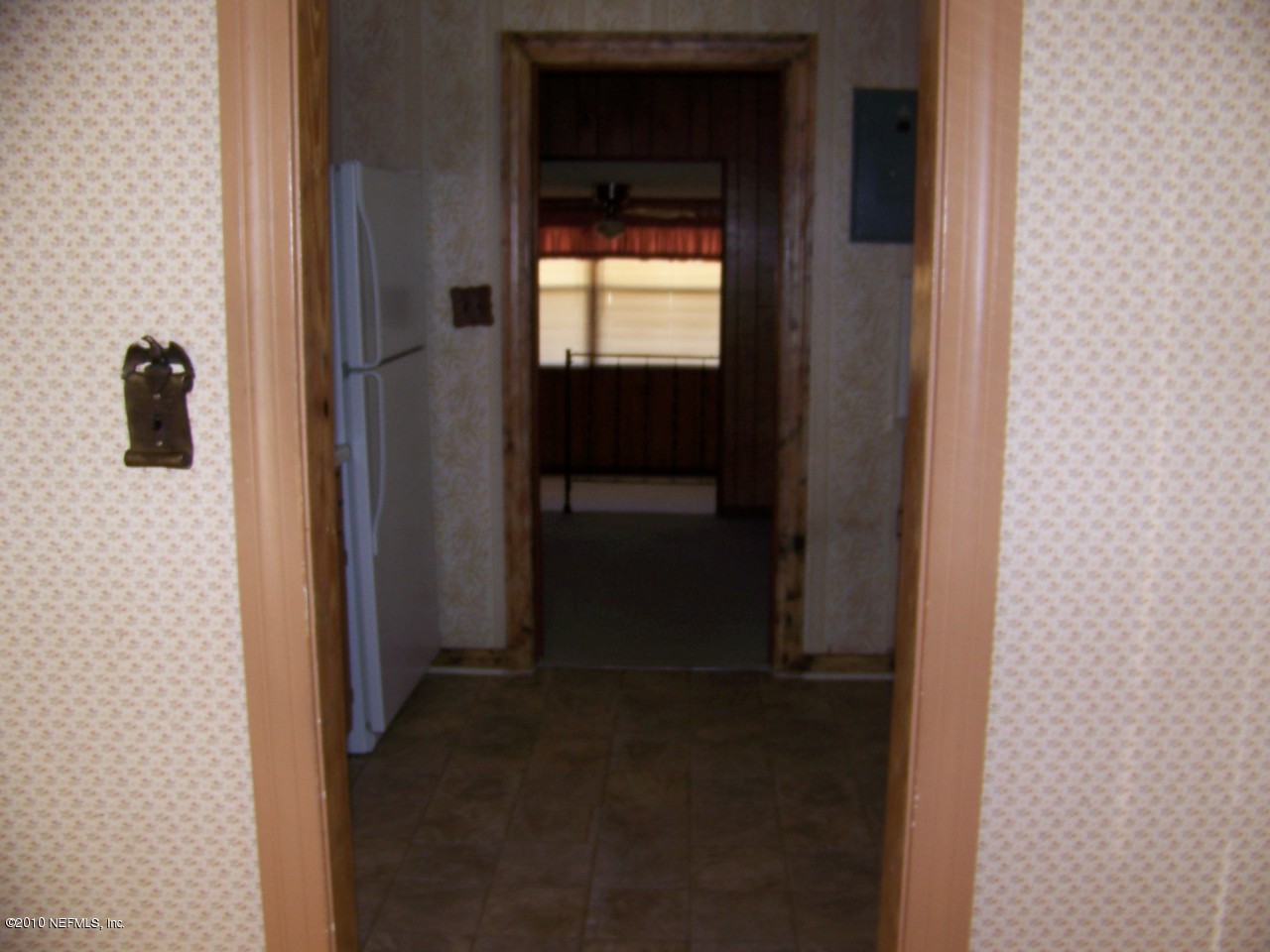 9761 Kline Road Jacksonville, FL 32246 - Photo 16 of 71 a view of a closet area with living room