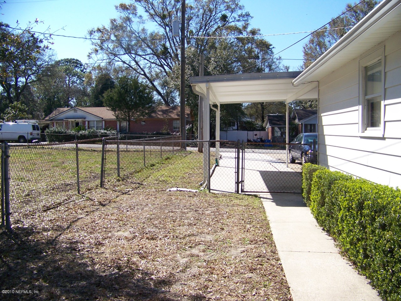 9761 Kline Road Jacksonville, FL 32246 - Photo 44 of 71 a view of a house with backyard porch and sitting area