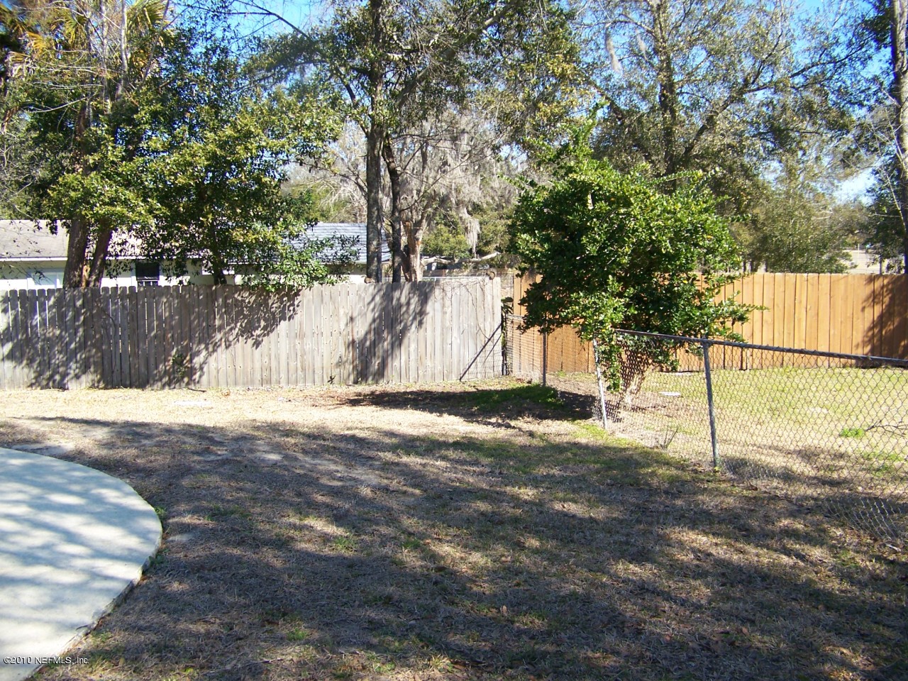 9761 Kline Road Jacksonville, FL 32246 - Photo 48 of 71 a house with trees in front of it