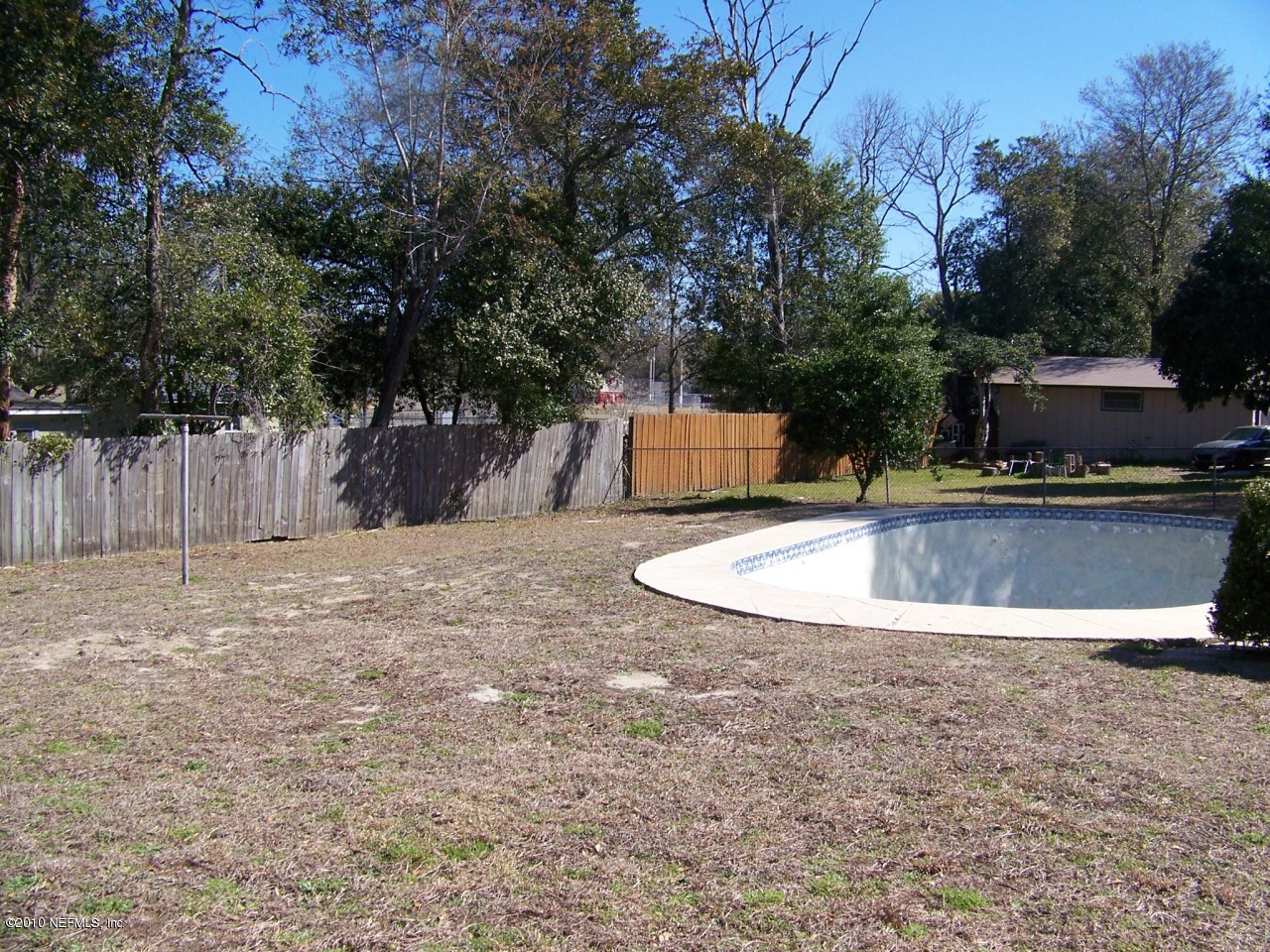 9761 Kline Road Jacksonville, FL 32246 - Photo 53 of 71 a view of a swimming pool with a patio