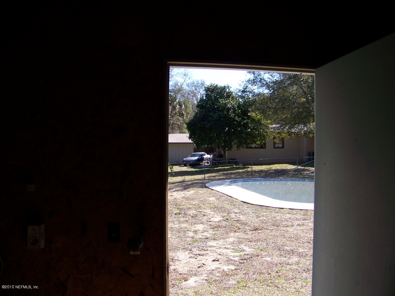 9761 Kline Road Jacksonville, FL 32246 - Photo 62 of 71 a view of a floor to ceiling window and a yard