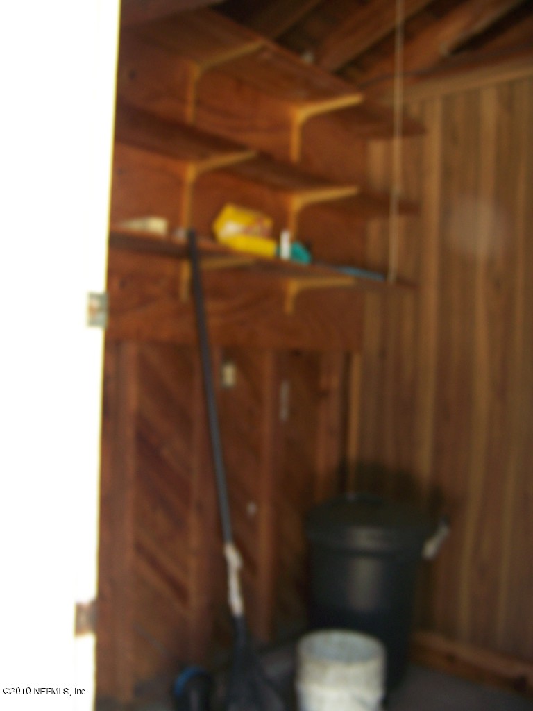 9761 Kline Road Jacksonville, FL 32246 - Photo 64 of 71 a bathroom with a shower curtain