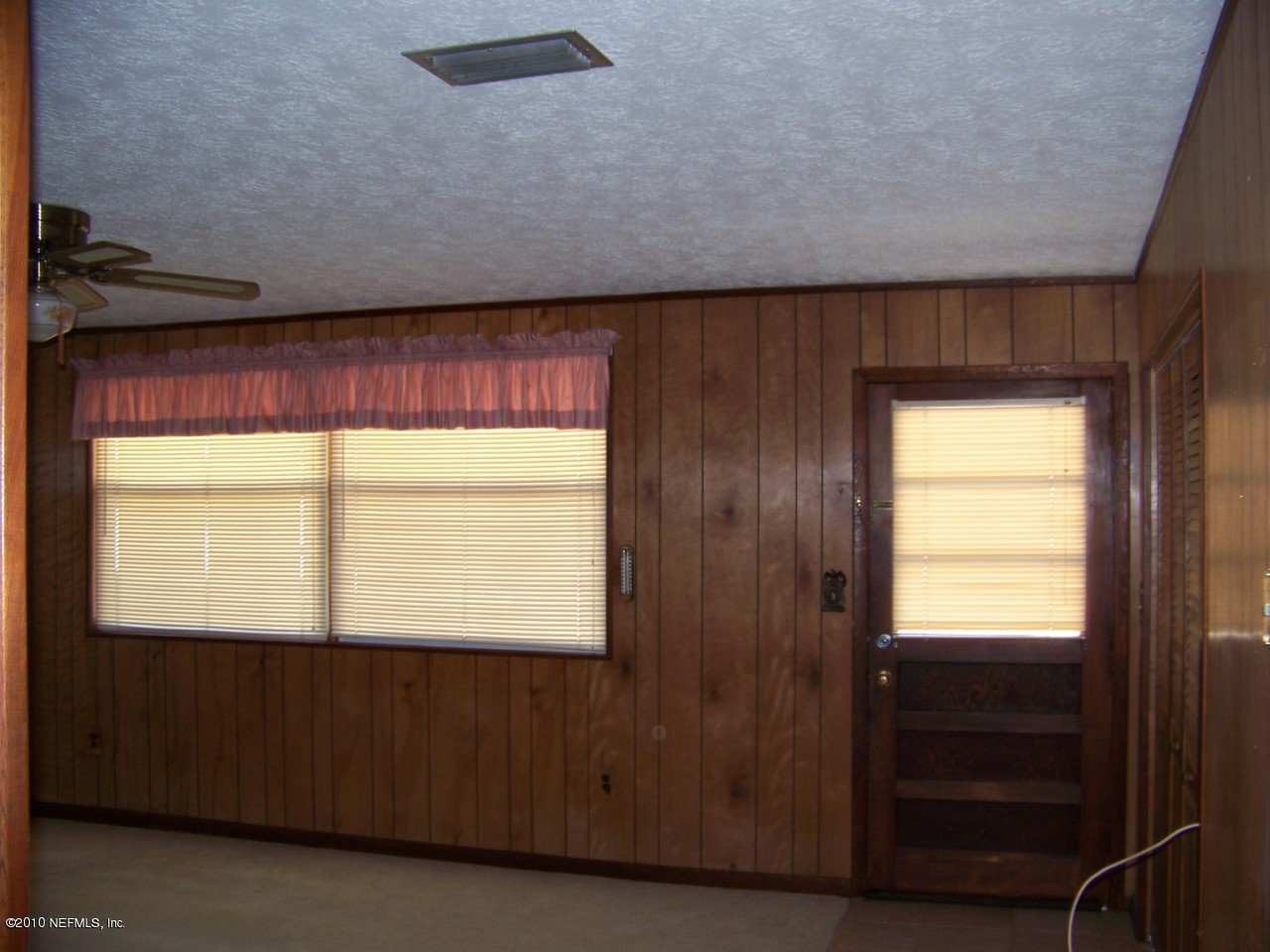 9761 Kline Road Jacksonville, FL 32246 - Photo 7 of 71 a view of an empty room with a window