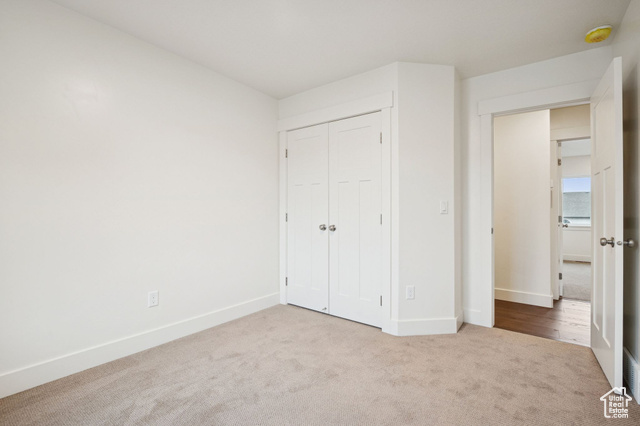 1615 North Angel Street, Unit F Layton, UT 84041 - Photo 9 of 45 Unfurnished bedroom with carpet floors and a closet