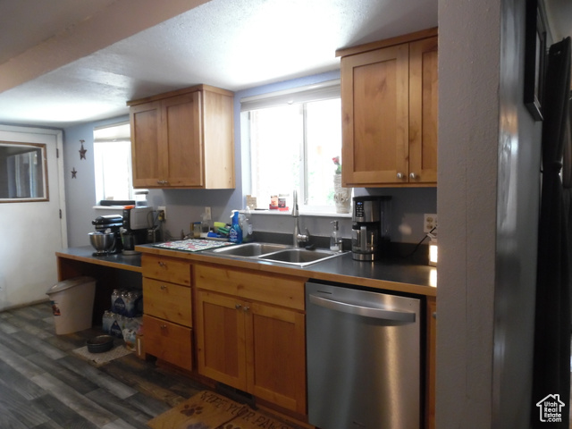 477 Grand Circle Moab, UT 84532 - Photo 6 of 22 Kitchen with dishwasher, a sink, and dark wood-style flooring
