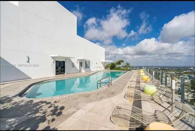 a view of swimming pool with a patio