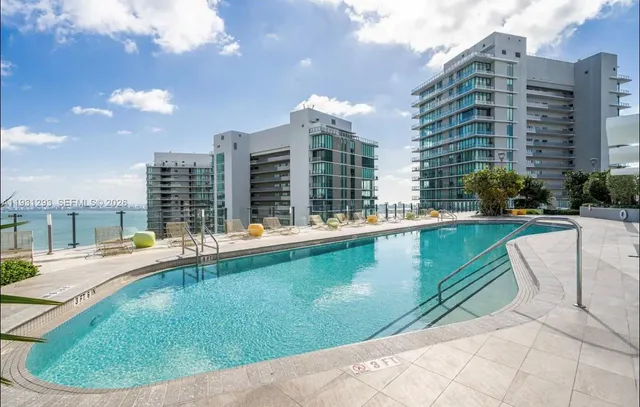 a view of swimming pool from a lounge chair