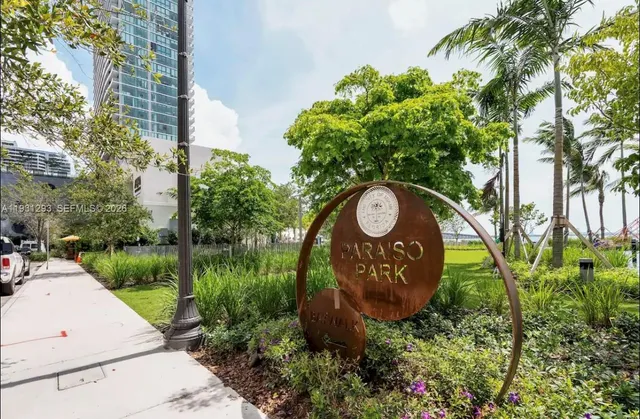 a sign that is on a brick wall