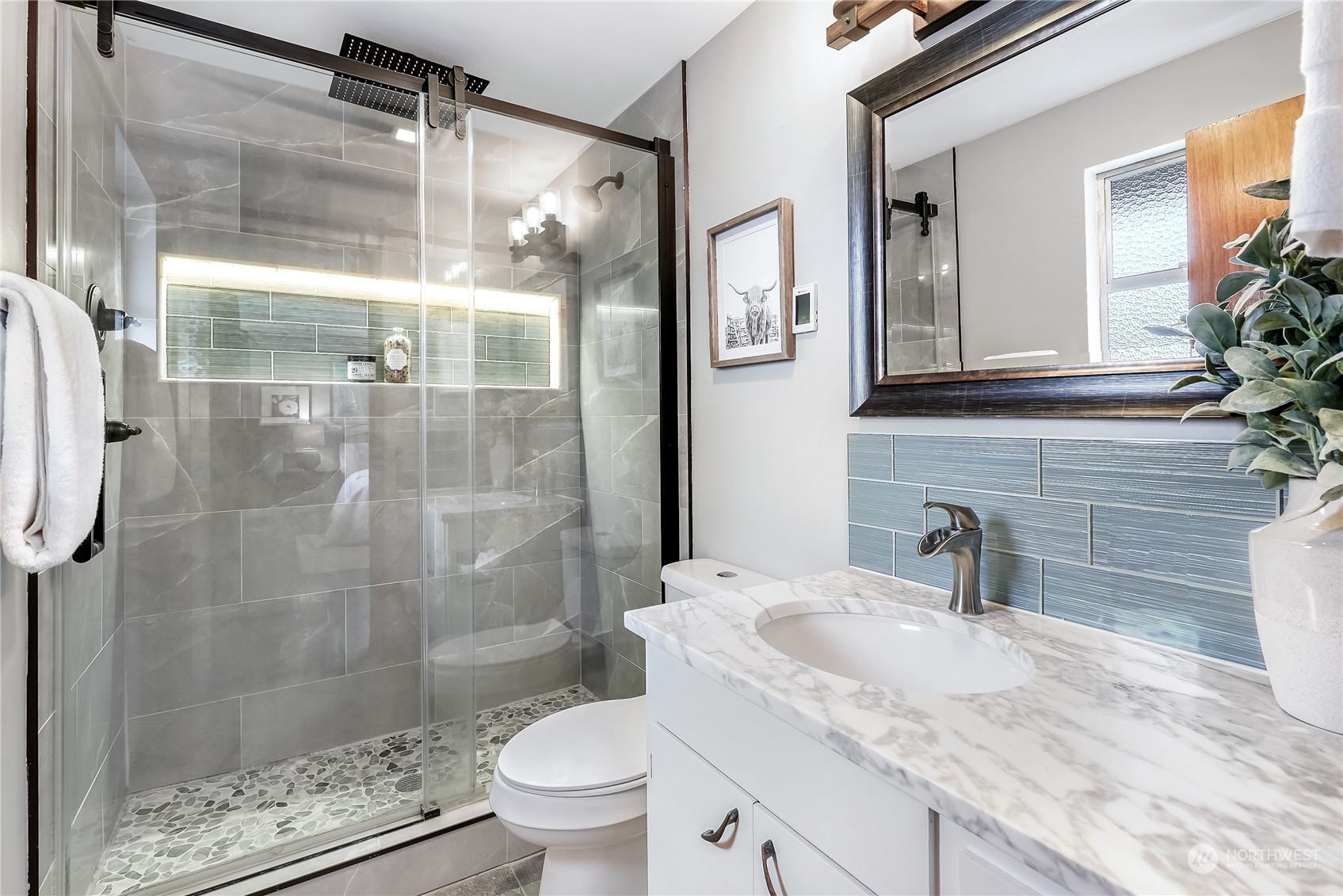 3112 Talbot Road South Renton, WA 98055 - Photo 14 of 29 a bathroom with a granite countertop sink toilet and shower