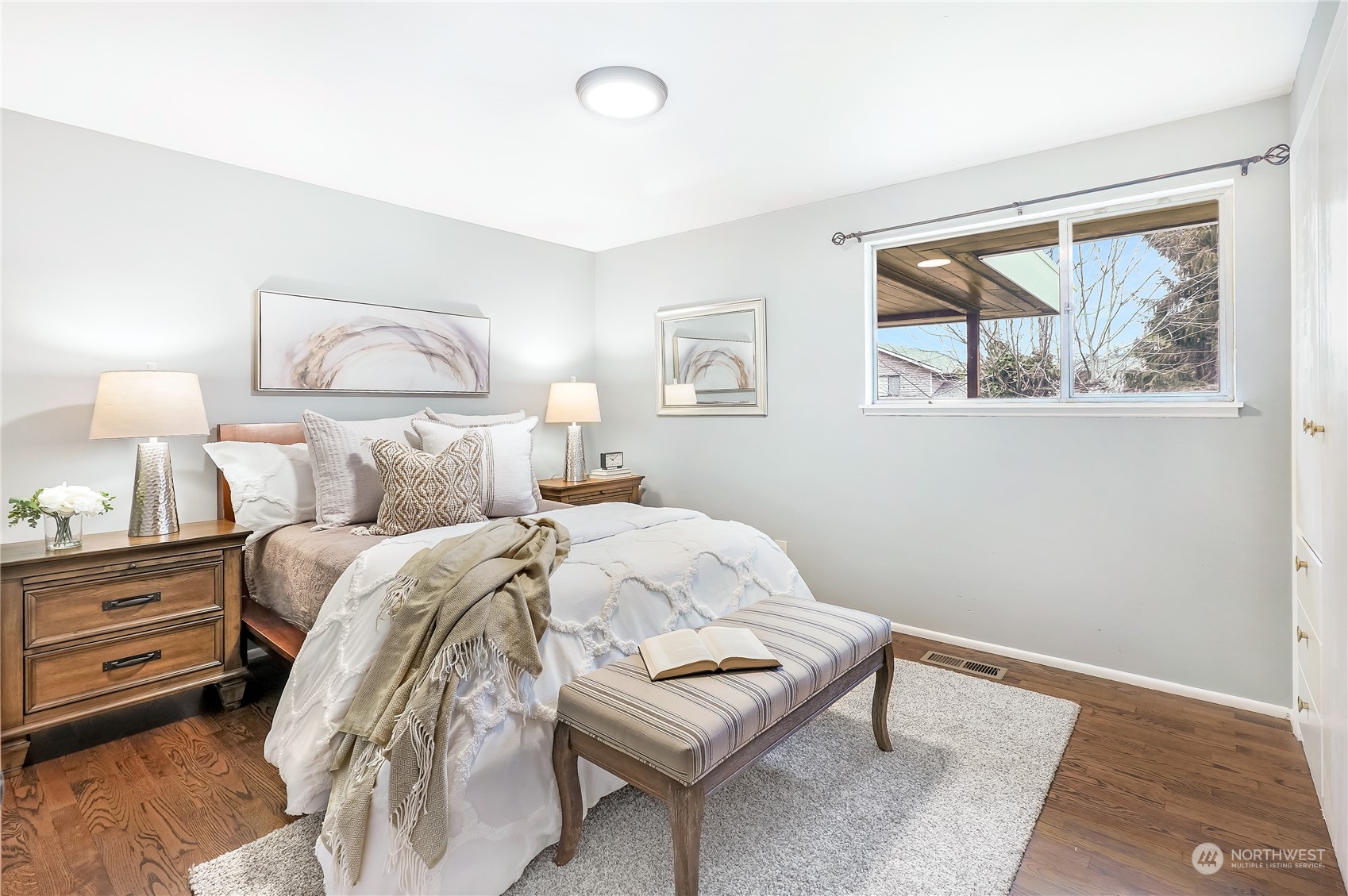 3112 Talbot Road South Renton, WA 98055 - Photo 15 of 29 a bedroom with a bed and a painting on the wall