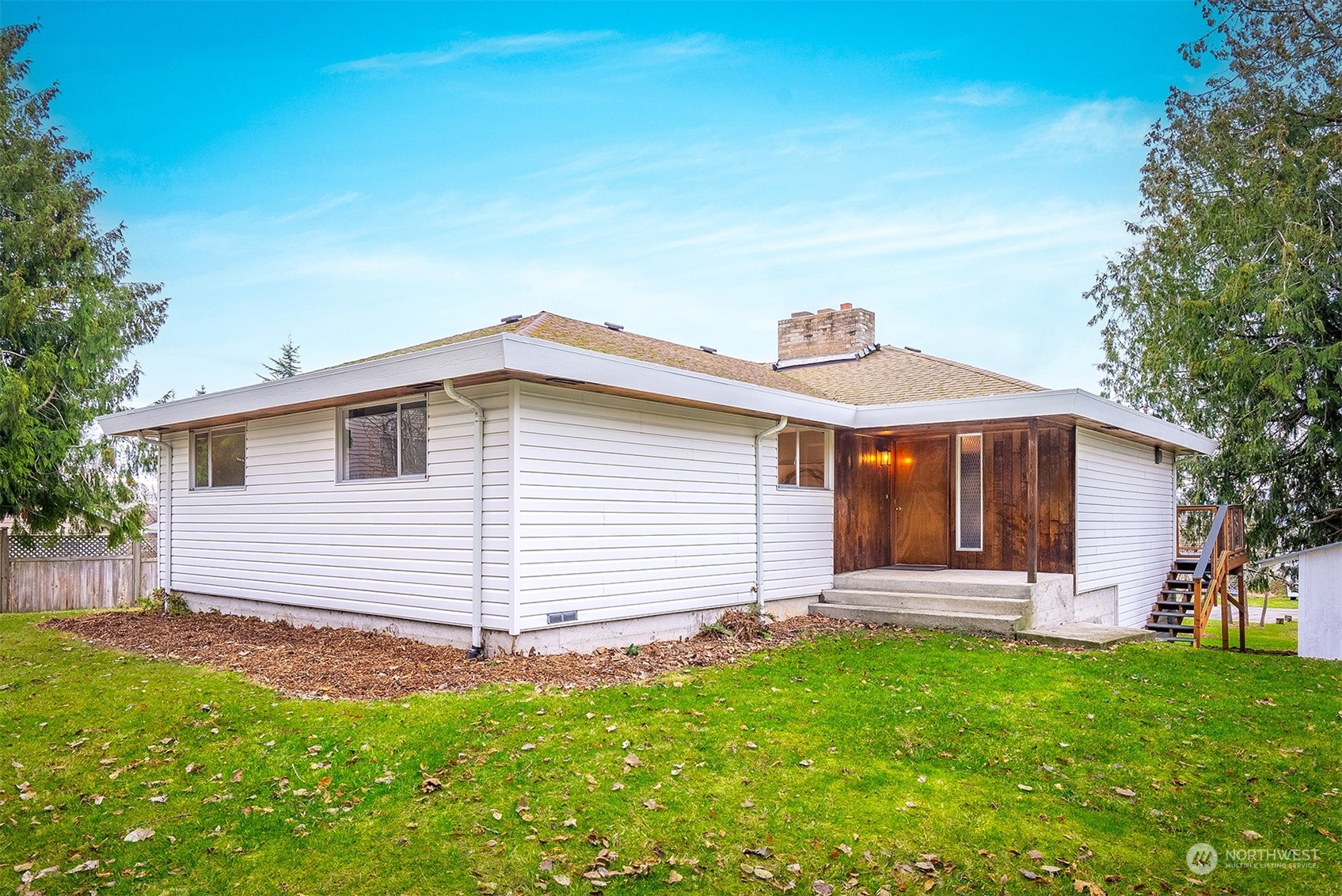 3112 Talbot Road South Renton, WA 98055 - Photo 2 of 29 a front view of a house with a garden