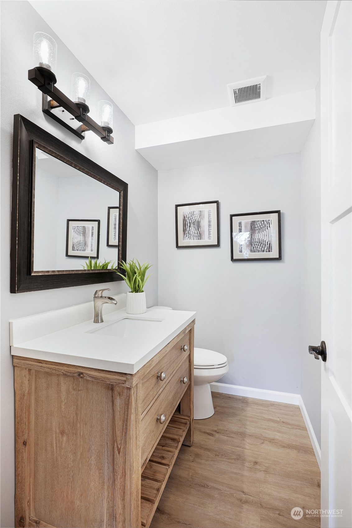 3112 Talbot Road South Renton, WA 98055 - Photo 21 of 29 a bathroom with a sink and a mirror