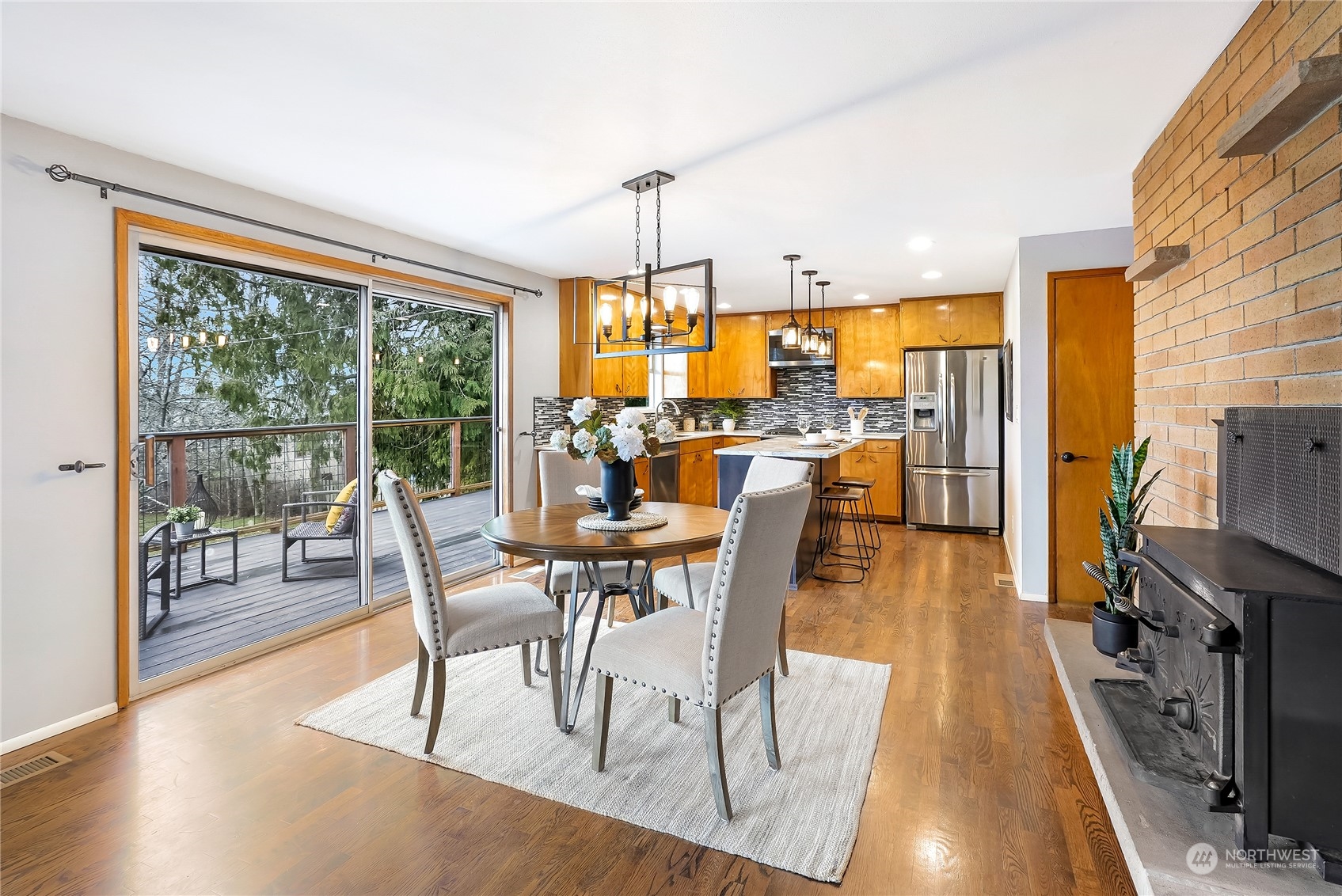 3112 Talbot Road South Renton, WA 98055 - Photo 9 of 29 a view of a dining room with furniture window and wooden floor