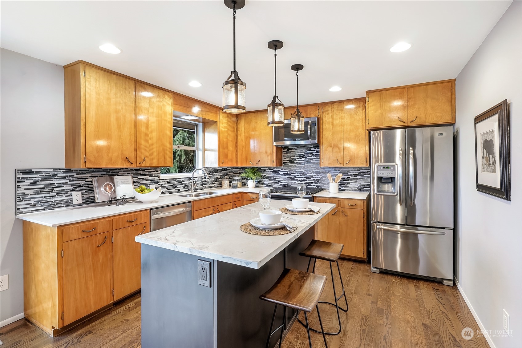 3112 Talbot Road South Renton, WA 98055 - Photo 10 of 29 a kitchen with granite countertop a sink appliances and cabinets