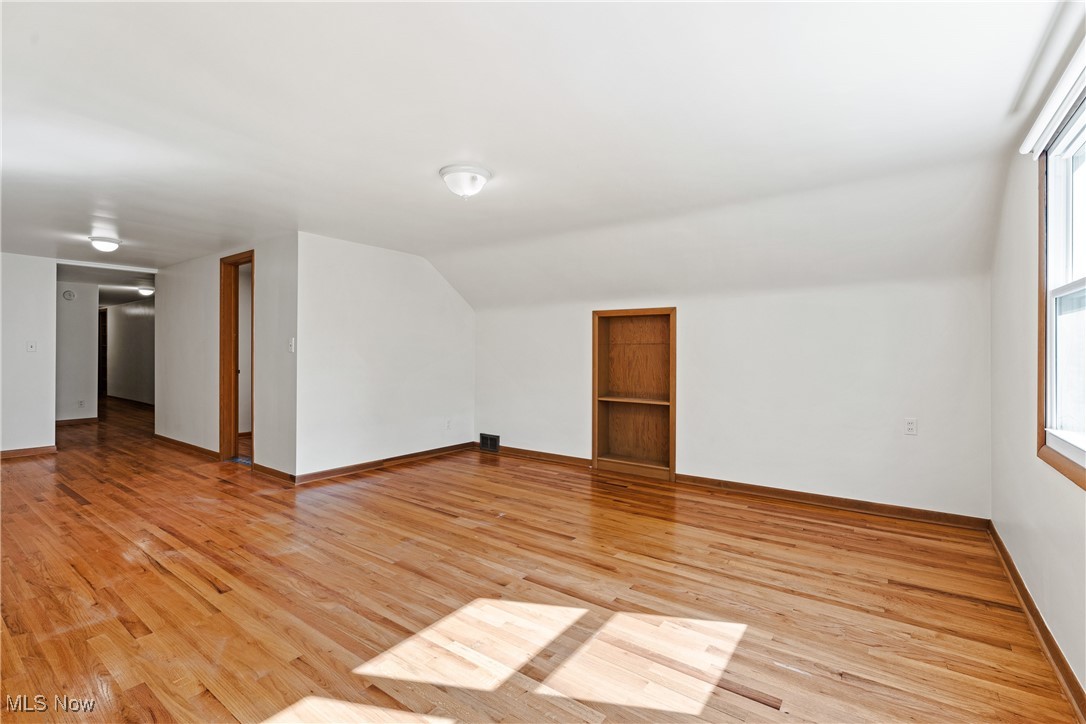 870 Trebisky Road Cleveland, OH 44121 - Photo 34 of 48 Additional living space with light hardwood / wood-style flooring and lofted ceiling