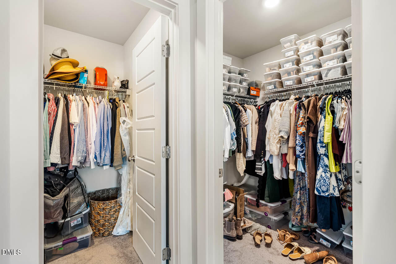2311 Great Ridge Parkway Chapel Hill, NC 27516 - Photo 22 of 57 a view of walk in closet with clothes and shoes