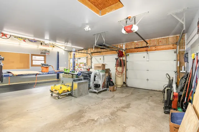 a view of a house with swimming pool and a garden
