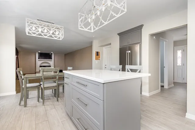 a kitchen with a sink and cabinets