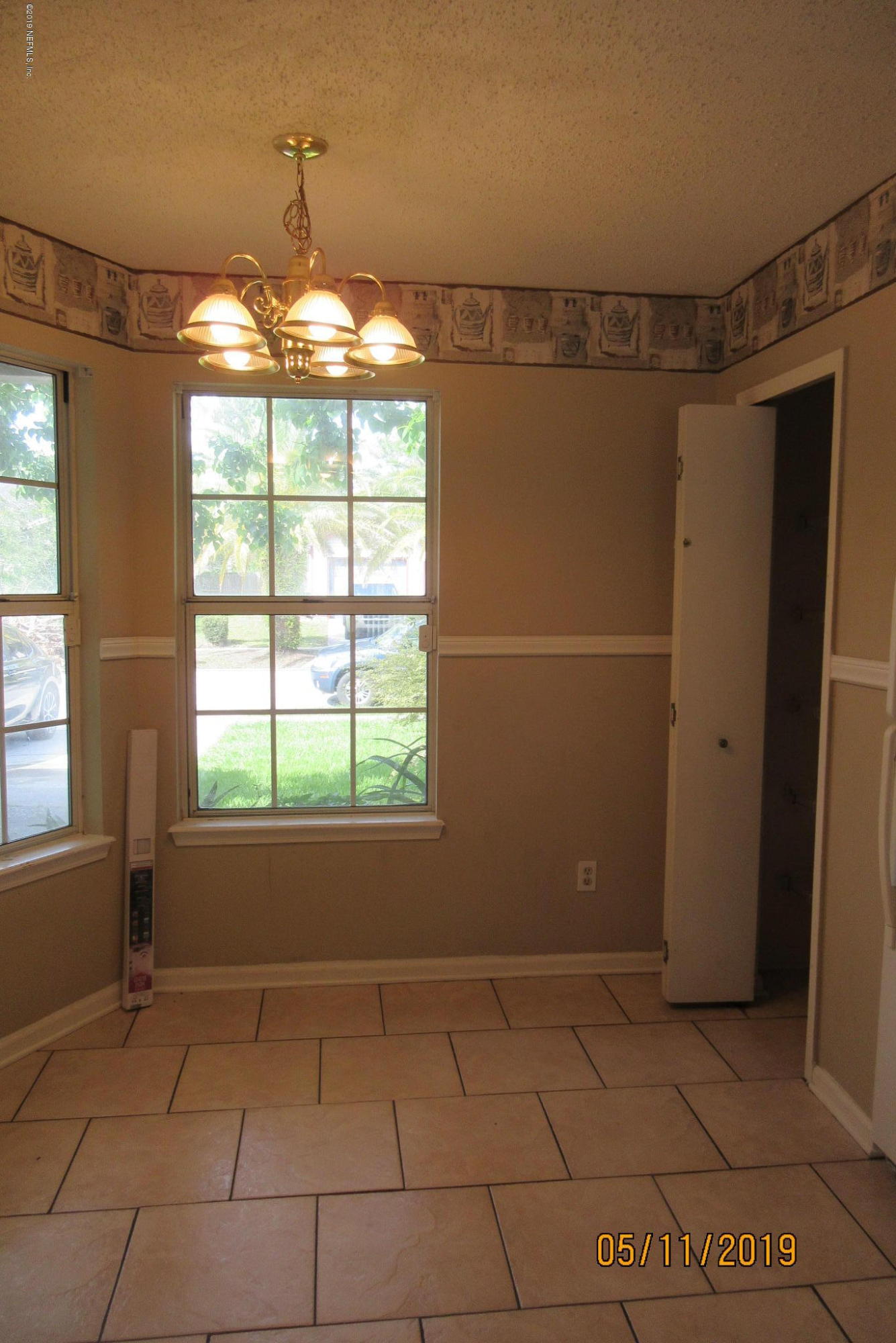 2465 Spring Vale Road Jacksonville, FL 32246 - Photo 4 of 11 a view of an empty room with a window