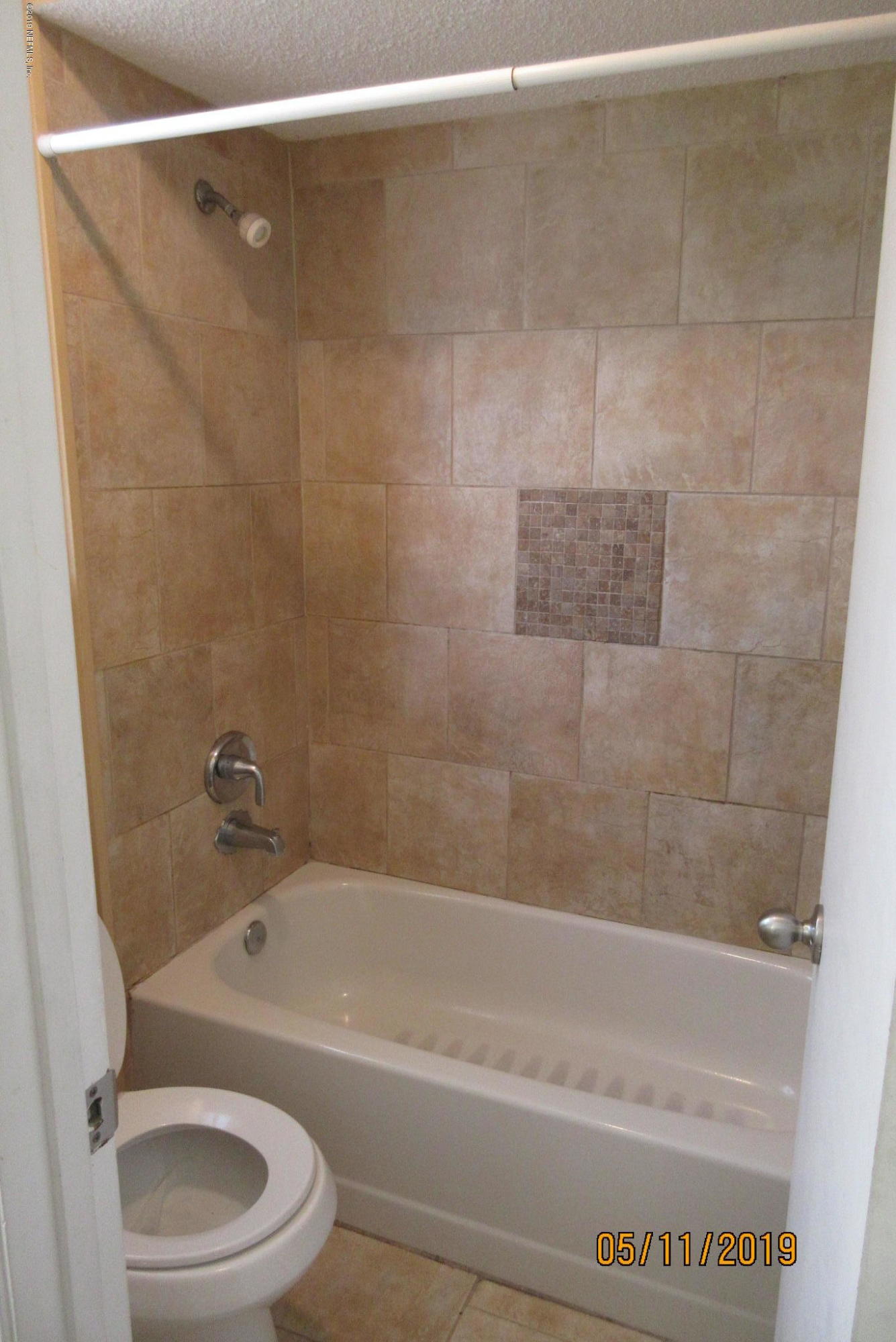 2465 Spring Vale Road Jacksonville, FL 32246 - Photo 10 of 11 a bathroom with a bathtub and a toilet