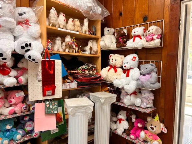 a vase of flowers sitting on a floor