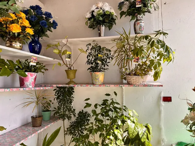 a flower vase with flowers and flowers