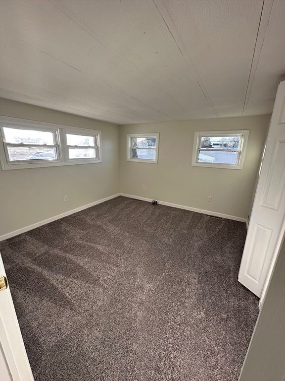 165 Newbury Street, Unit 2 Peabody, MA 01960 - Photo 4 of 8 a view of empty room with window