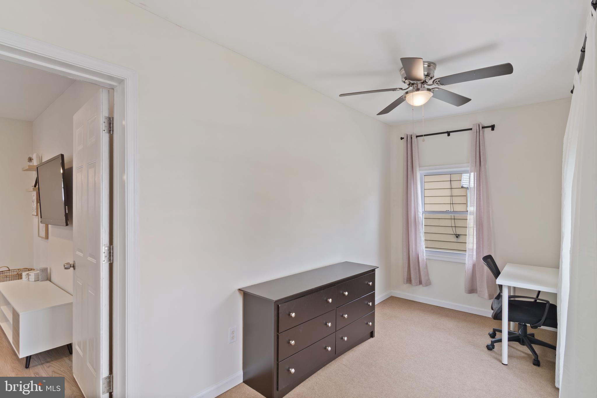 6915 Homeway Baltimore, MD 21222 - Photo 4 of 27 a view of a workspace with furniture and a window