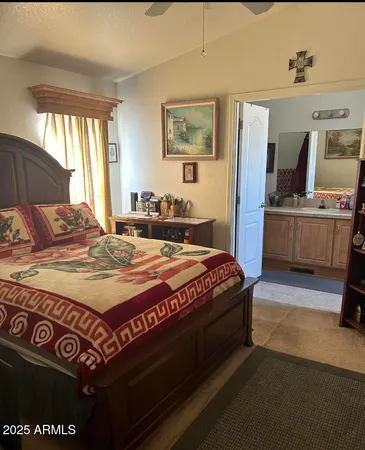 a bedroom with a bed and window