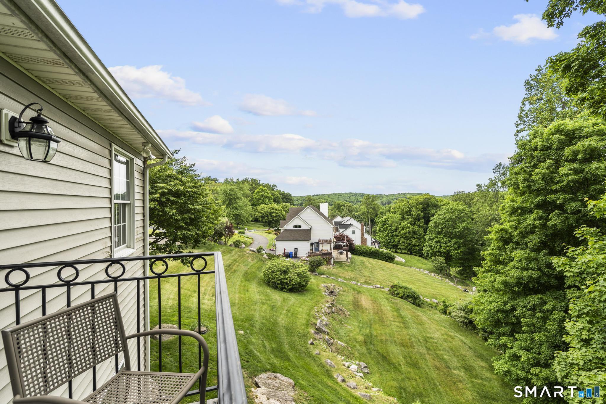 12 Logans Way Danbury, CT 06811 - Photo 22 of 40 a view of a garden from a balcony