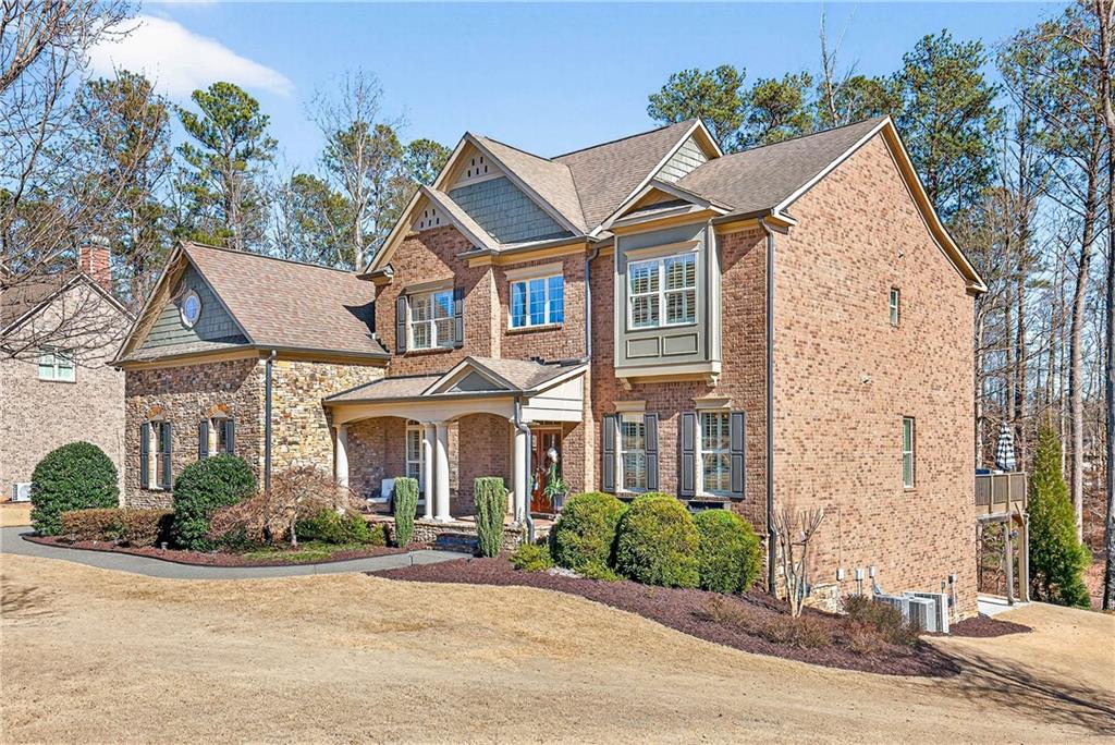 340 Scott Farm Drive Powder Springs, GA 30127 - Photo 2 of 59 front view of a brick house with a yard