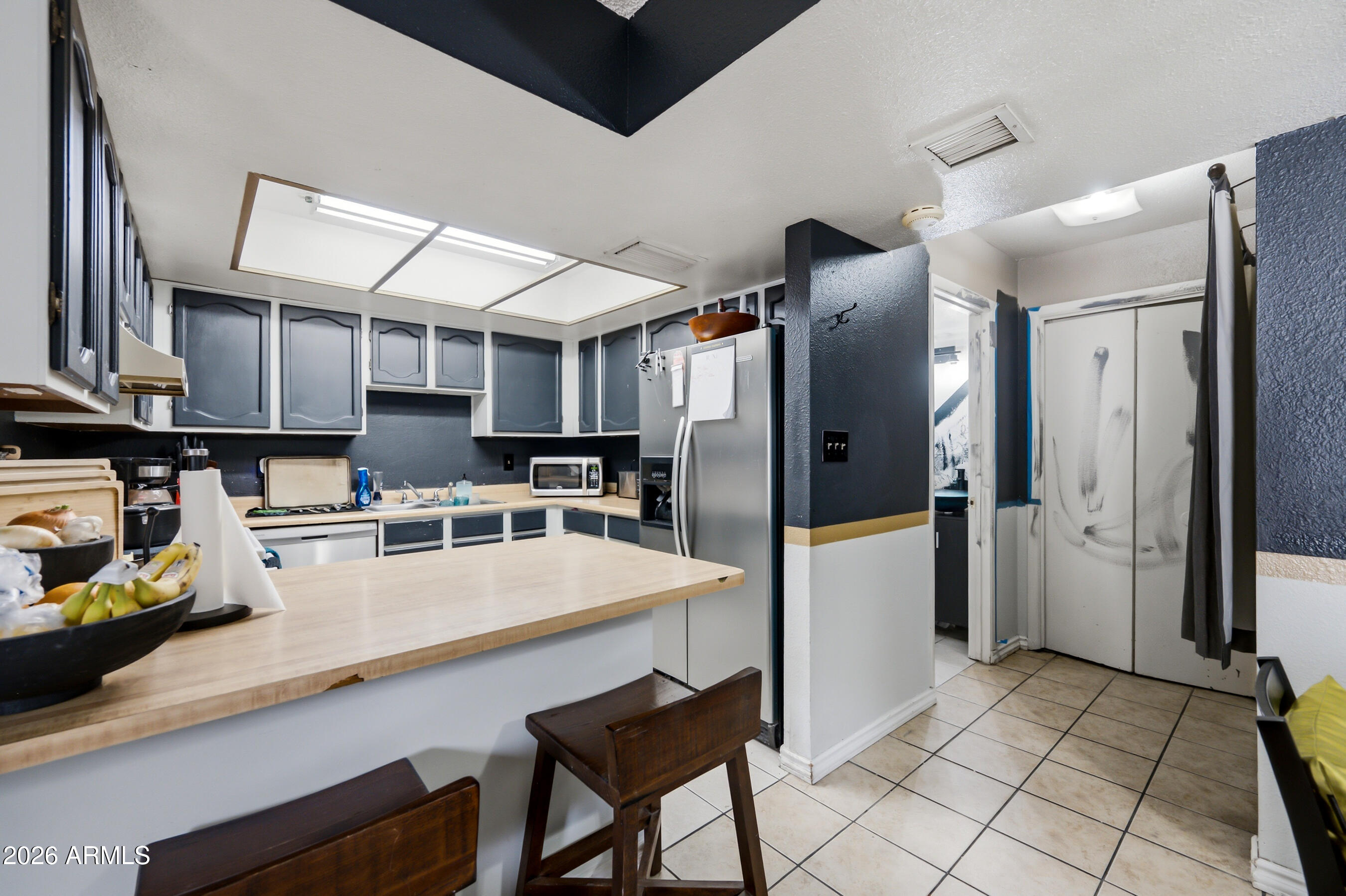1051 South Dobson Road, Unit 187 Mesa, AZ 85202 - Photo 11 of 18 a large kitchen with lots of counter space and refrigerator