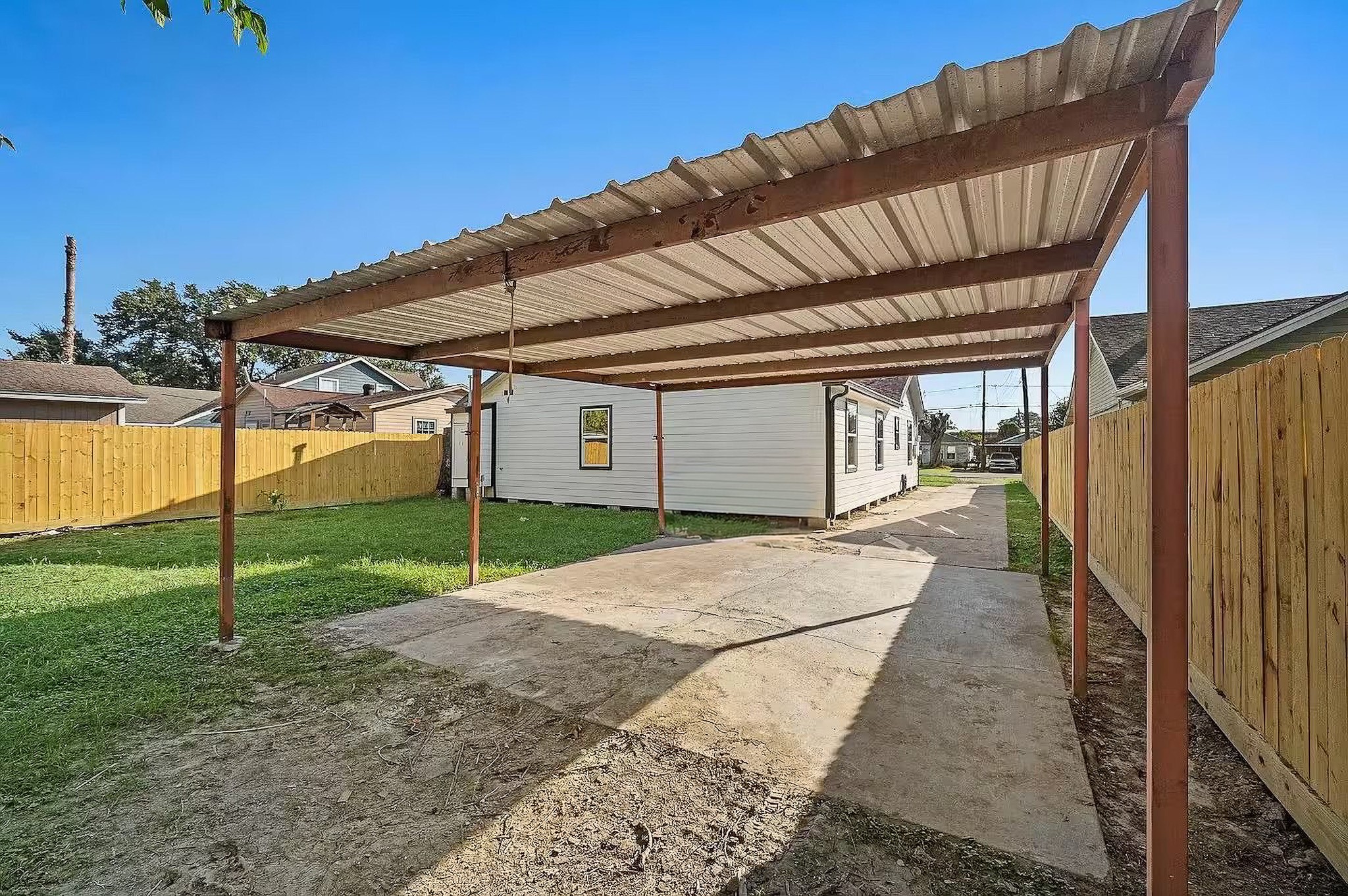6305 Gay Street Houston, TX 77022 - Photo 13 of 13 a backyard of a house with table and chairs
