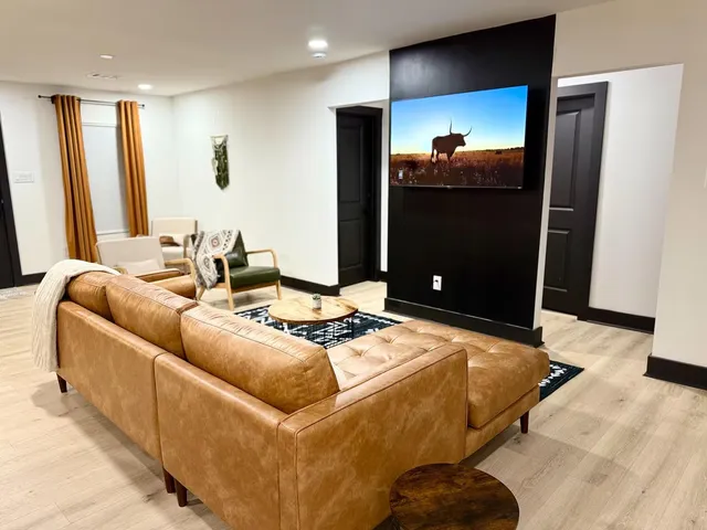 a living room with furniture and a flat screen tv