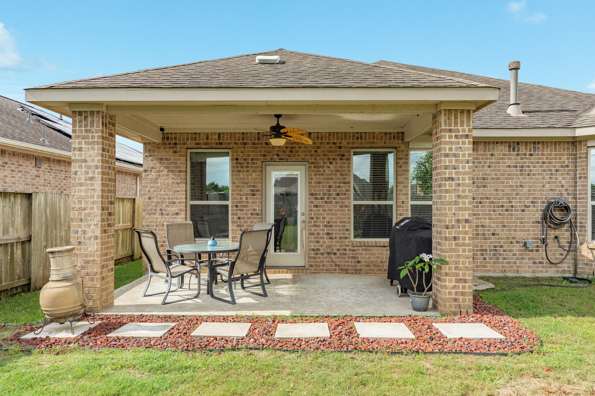 3519 Bay Drive Rosharon, TX 77583 - Photo 24 of 49 Spacious backyard featuring a large covered patio, perfectly designed for grilling and outdoor entertaining.