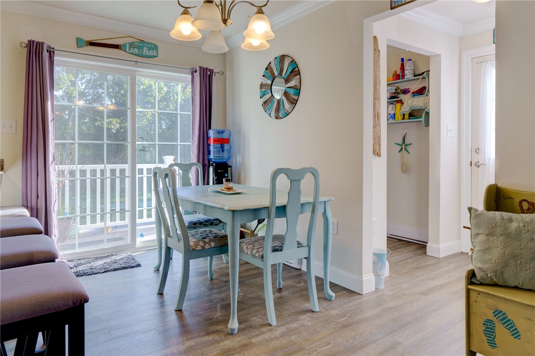 77 Benson Avenue Westerly, RI 02891 - Photo 11 of 42 Eating area and slider to the rear of the home. The laundry is to the right.