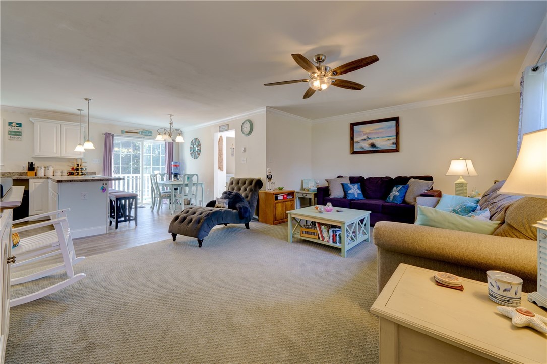 77 Benson Avenue Westerly, RI 02891 - Photo 13 of 42 Living room leading to the kitchen.