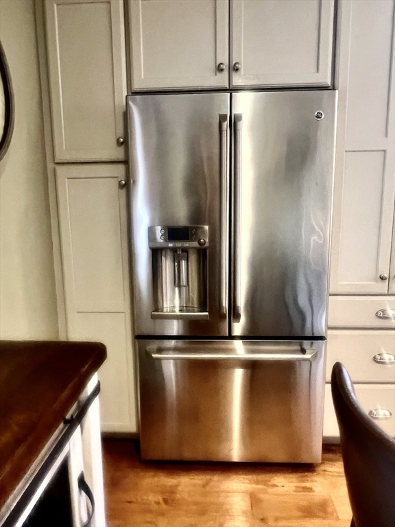 131 Pleasant Valley Street Methuen, MA 01844 - Photo 13 of 23 a view of a refrigerator in kitchen