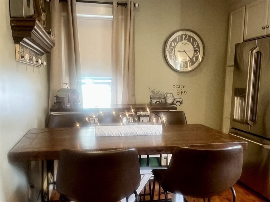 131 Pleasant Valley Street Methuen, MA 01844 - Photo 14 of 23 a view of a dining room with furniture